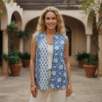 BUÍS STUDIO blue and white floral print reversible cotton vest with pockets, worn by a woman.