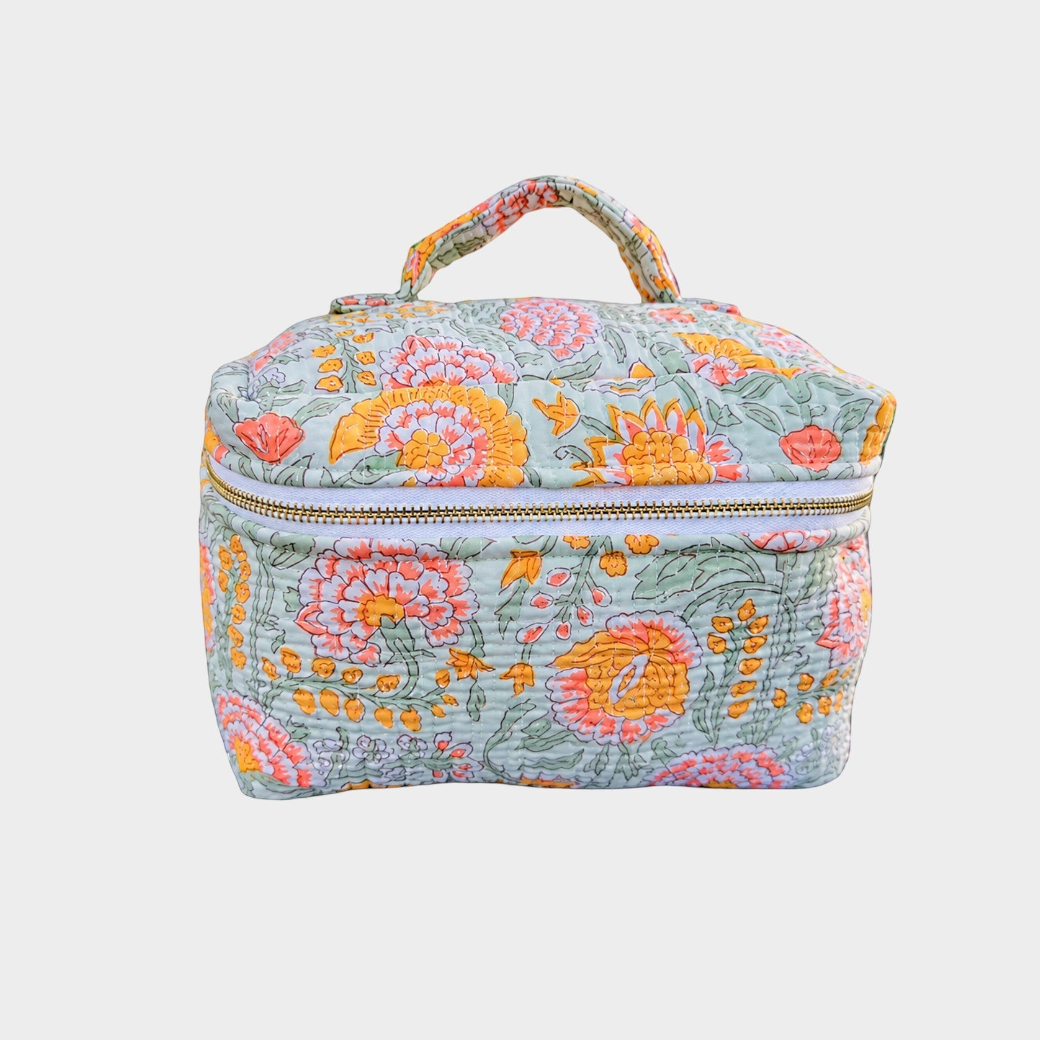 BUÍS STUDIO mint green quilted makeup bag with a colorful floral print and a top handle.