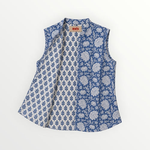 BUÍS STUDIO blue and white reversible cotton gilet with floral and leaf prints. Sleeveless, mandarin collar, and practical pockets.