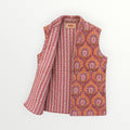 BUÍS STUDIO reversible cotton vest in orange, pink, and purple with a floral print on one side and stripes on the other.