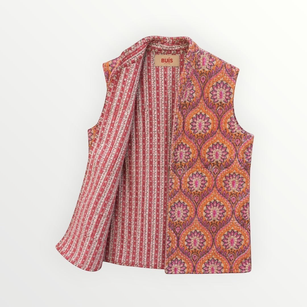 BUÍS STUDIO reversible cotton vest in orange, pink, and purple with a floral print on one side and stripes on the other.