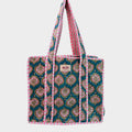 BUÍS STUDIO teal cotton tote bag with pink and green vintage-inspired print and striped handles.