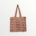 BUÍS STUDIO tote bag with a vintage-inspired print in beige, pink, and orange. Made of cotton with sturdy handles.